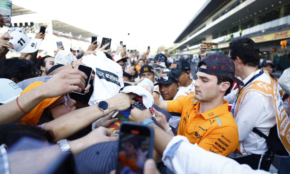 Man wearing orange amid protest crowd