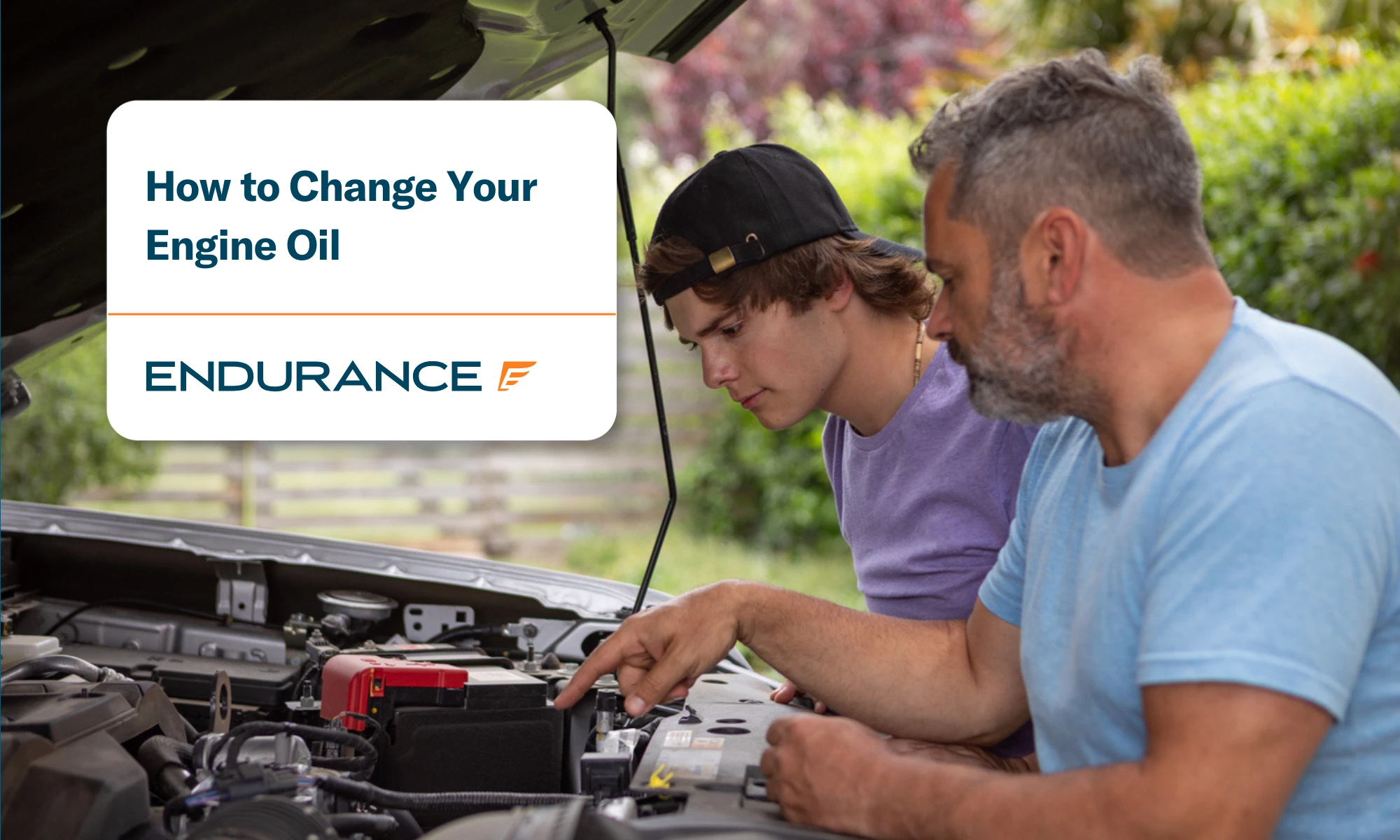 Father and son doing oil change