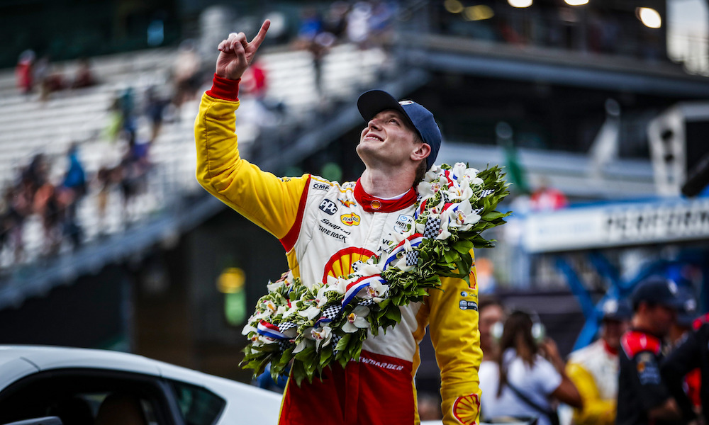 IndyCar driver with victory flowers