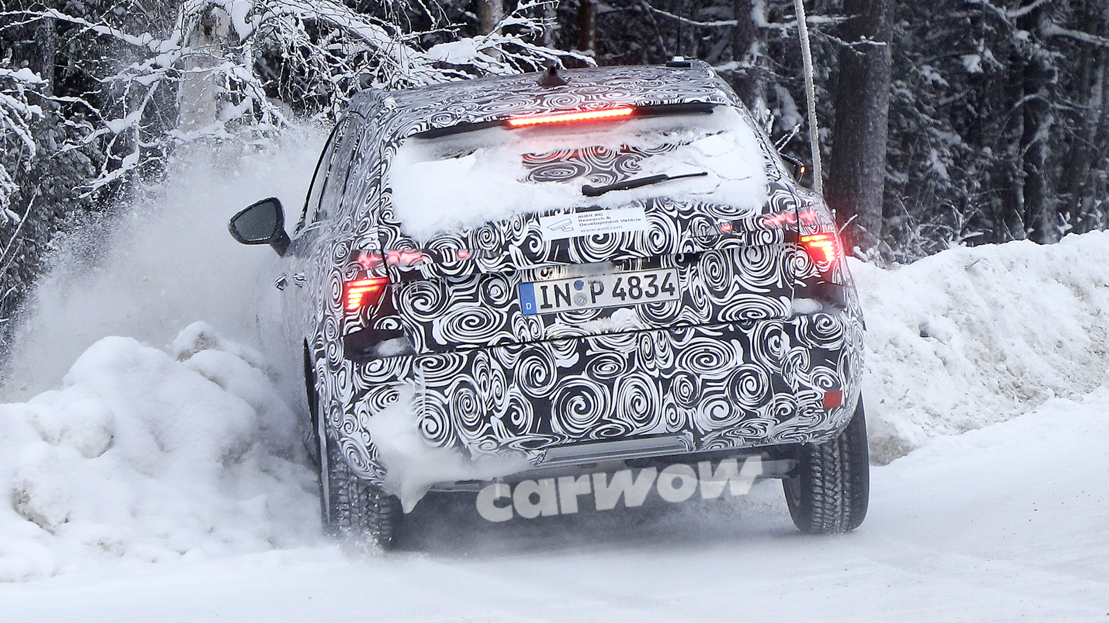 Audi Q3 crashing into snow