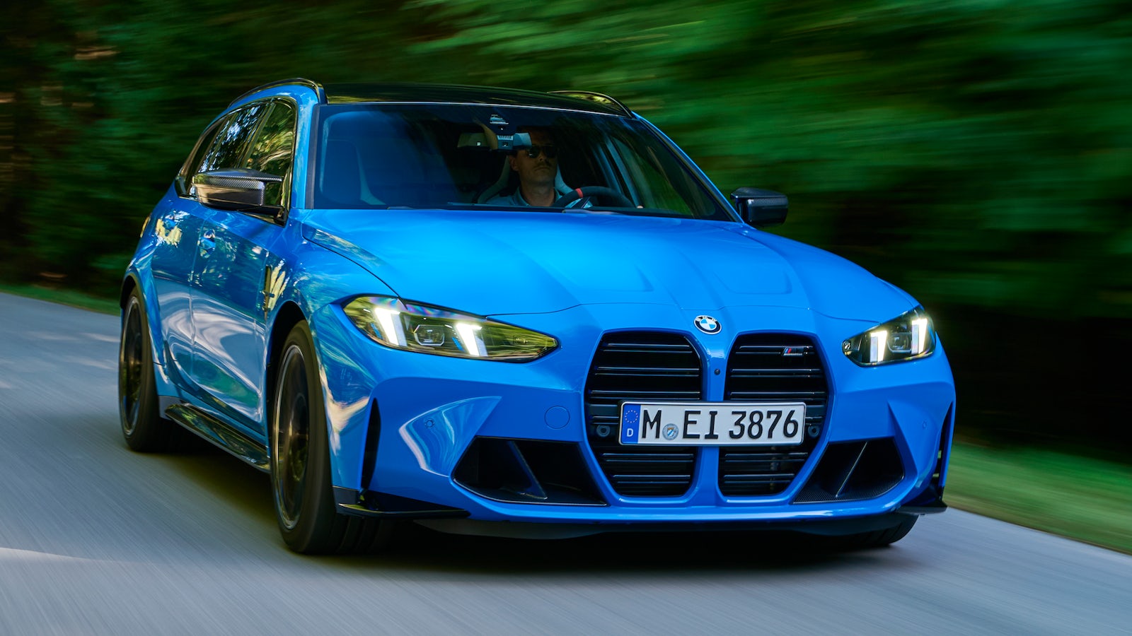 Blue BMW M3 Touring on road