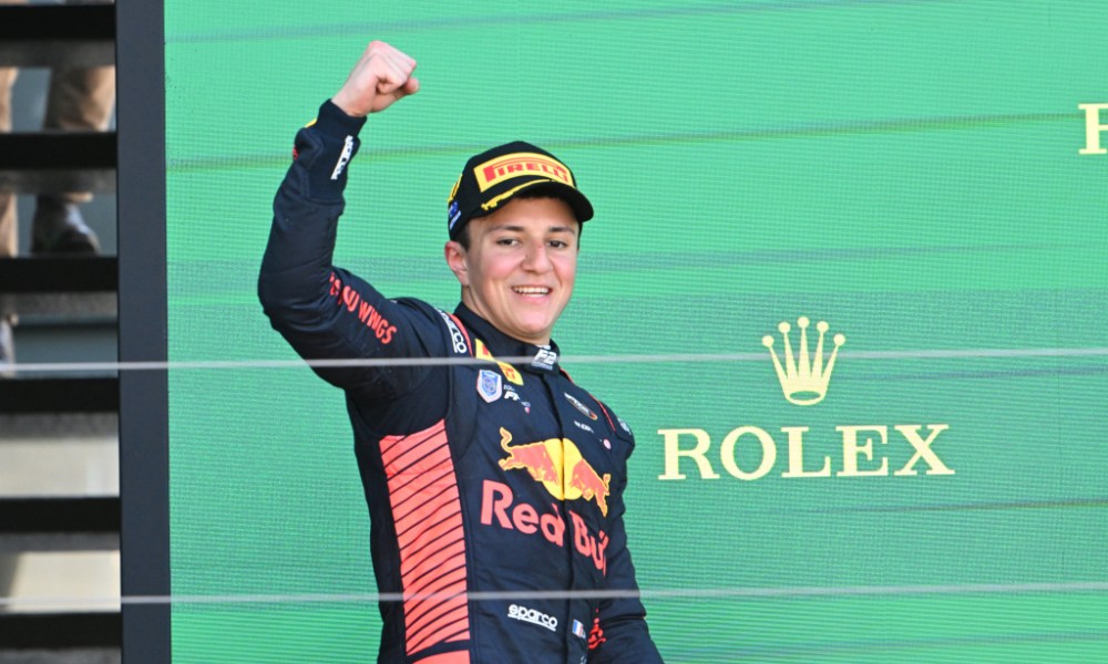 Smiling race car driver in uniform