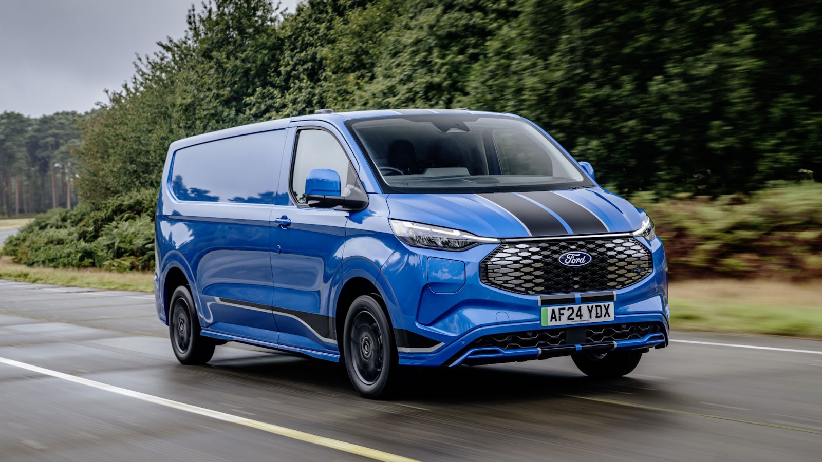 Blue Ford E-Transit Custom van driving