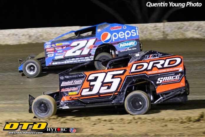 Sprint cars racing on dirt track