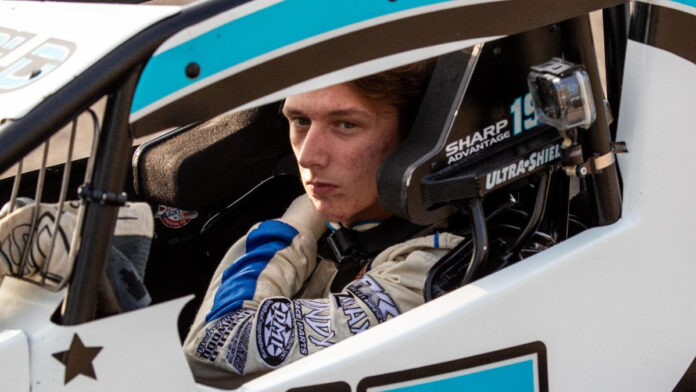 Driver in sprint car cockpit