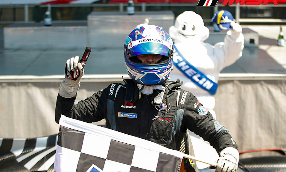 Racing driver with checkered flag