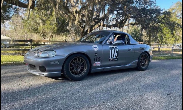 Spec Miata race car on track