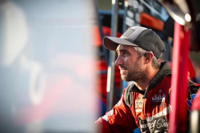 Race car driver in racing suit