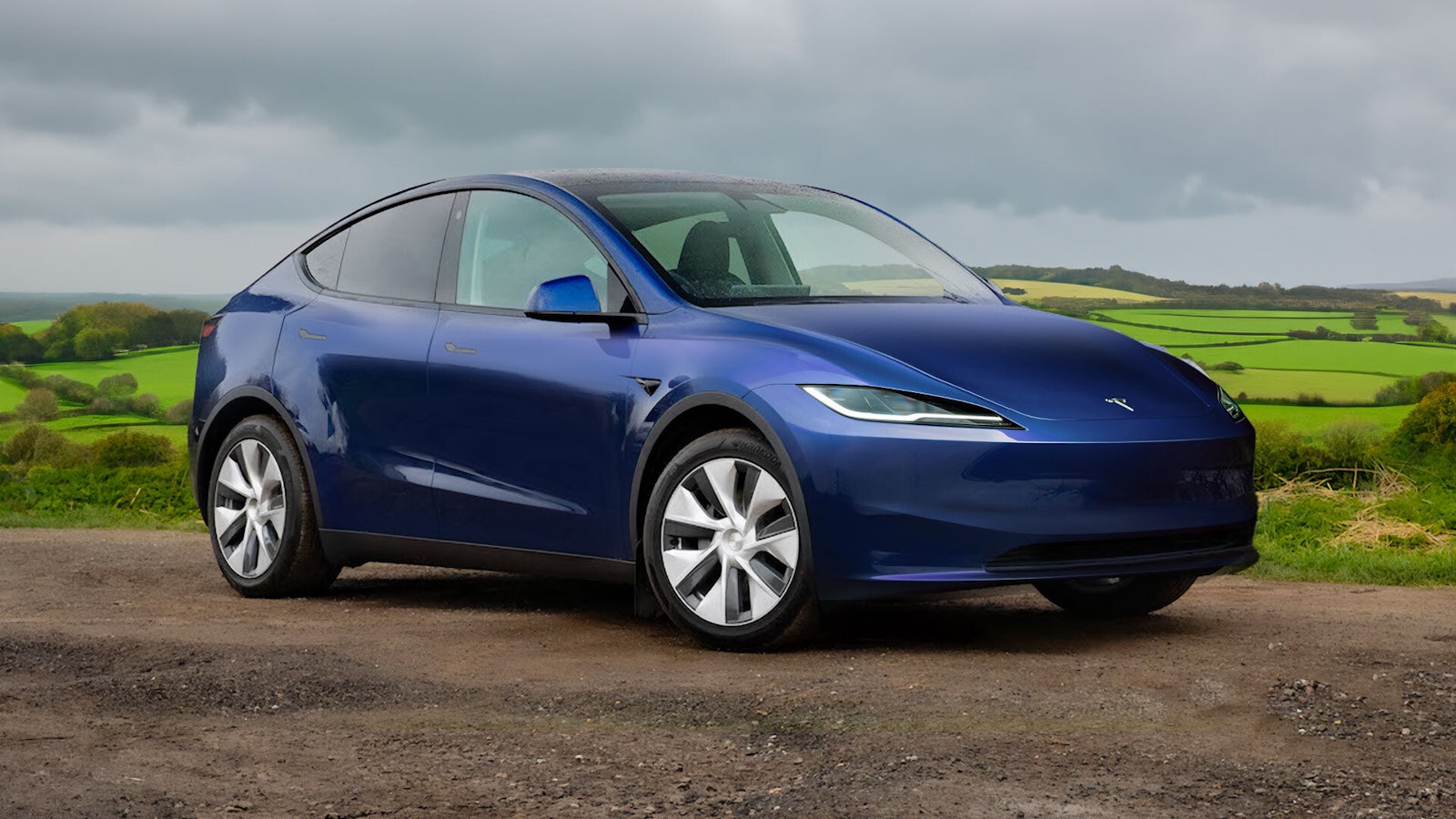 Tesla Model Y on dirt road