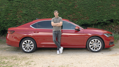 Man beside Skoda Superb