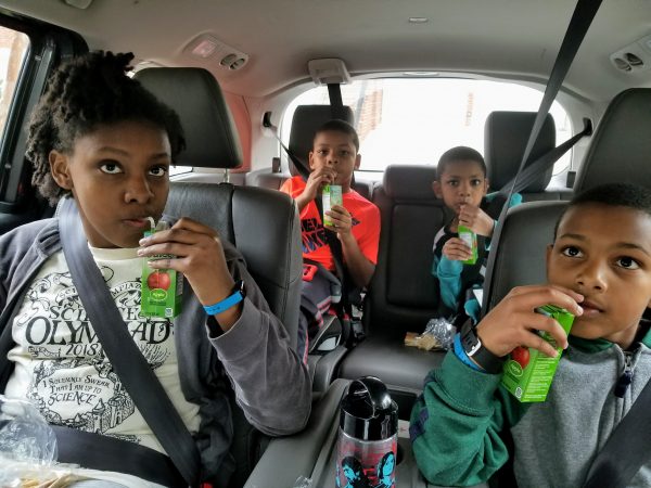 Kids drinking juice together