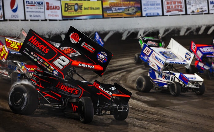 Modified sprint cars racing on dirt