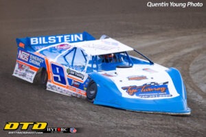 Race car speeding on dirt track