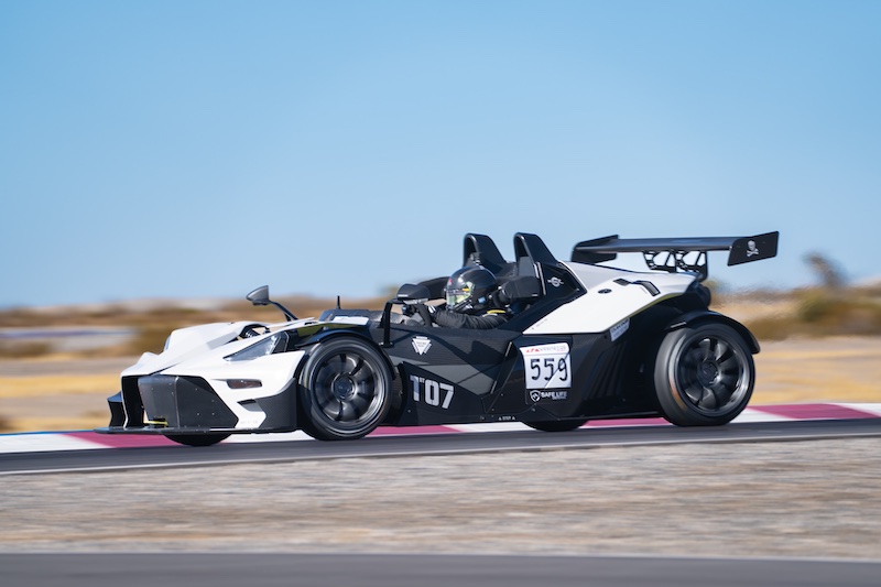 White racing car speeding ahead