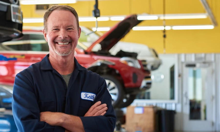 Mechanic standing confidently in auto shop