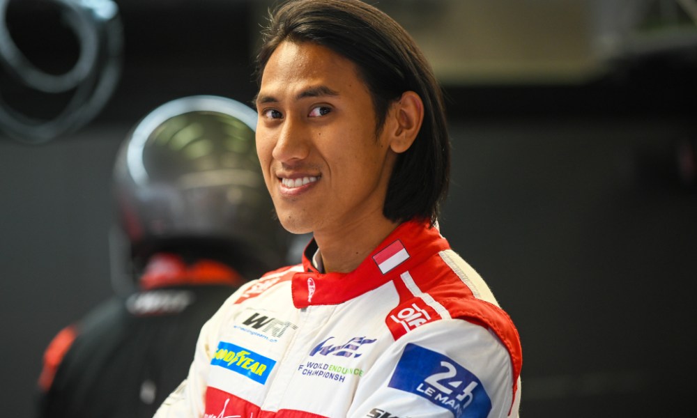 Smiling race driver in suit