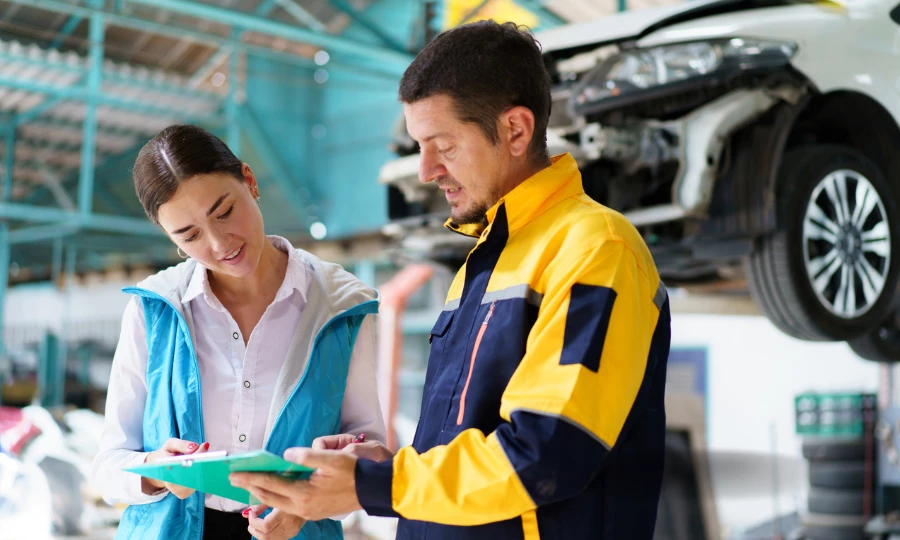 Man and woman discuss brake repair