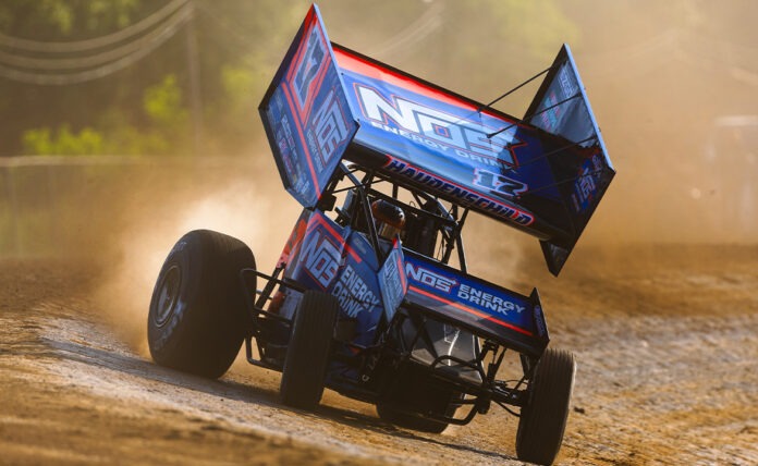 Sprint car racing on dirt track