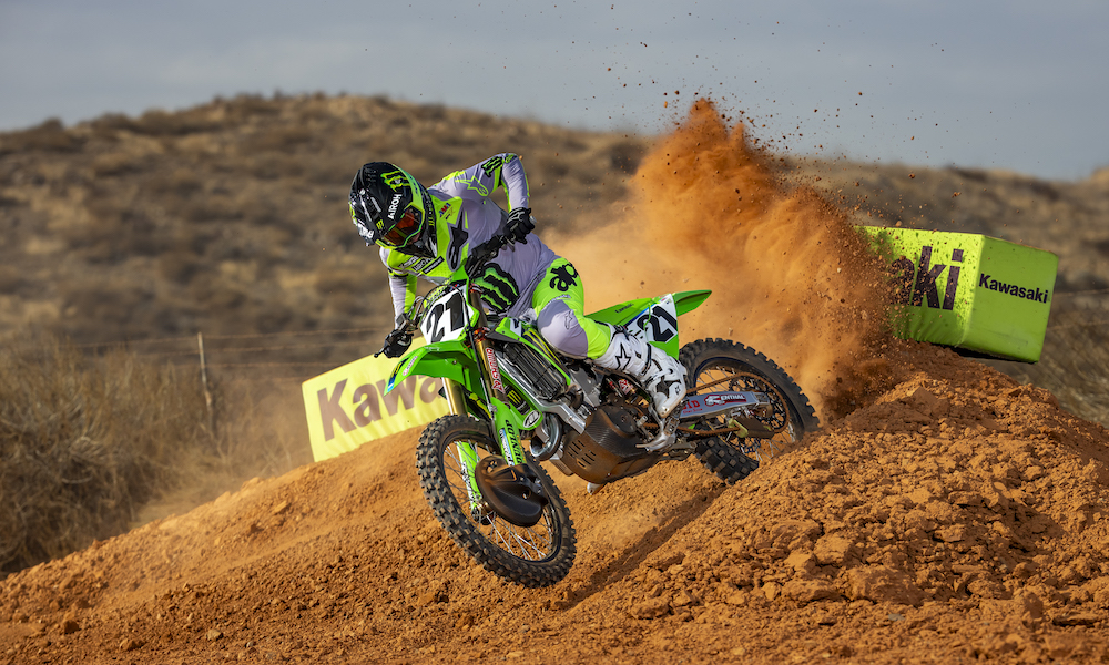 Motocross rider on green Kawasaki motorcycle