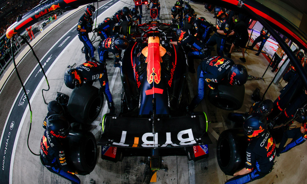 Race car surrounded by pit crew