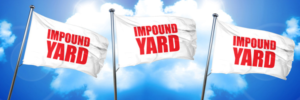 Impound lot flags in blue sky