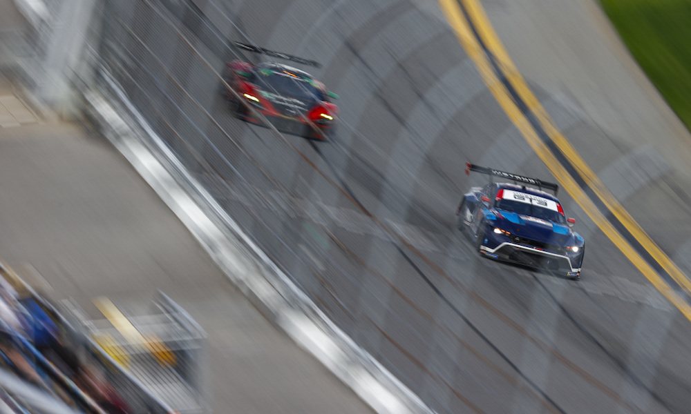 IMSA race cars battling at Daytona