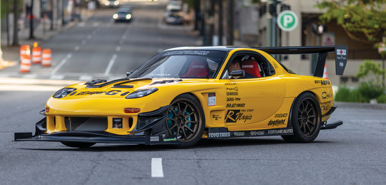 Yellow RX-7 on road