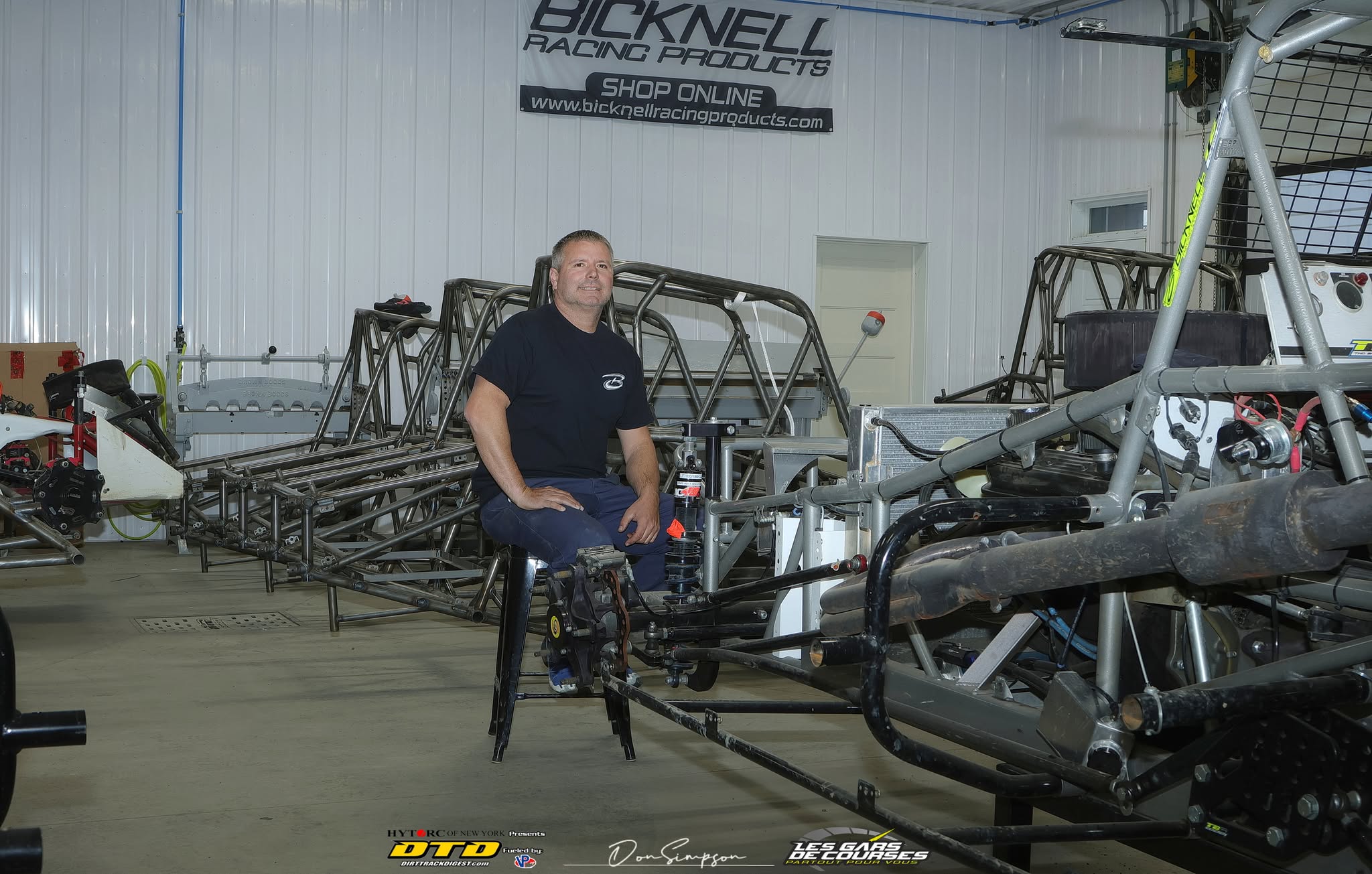 Man seated in garage workshop