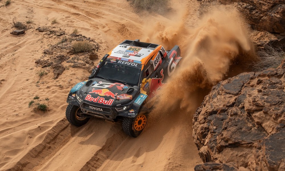 Off-road truck racing through desert