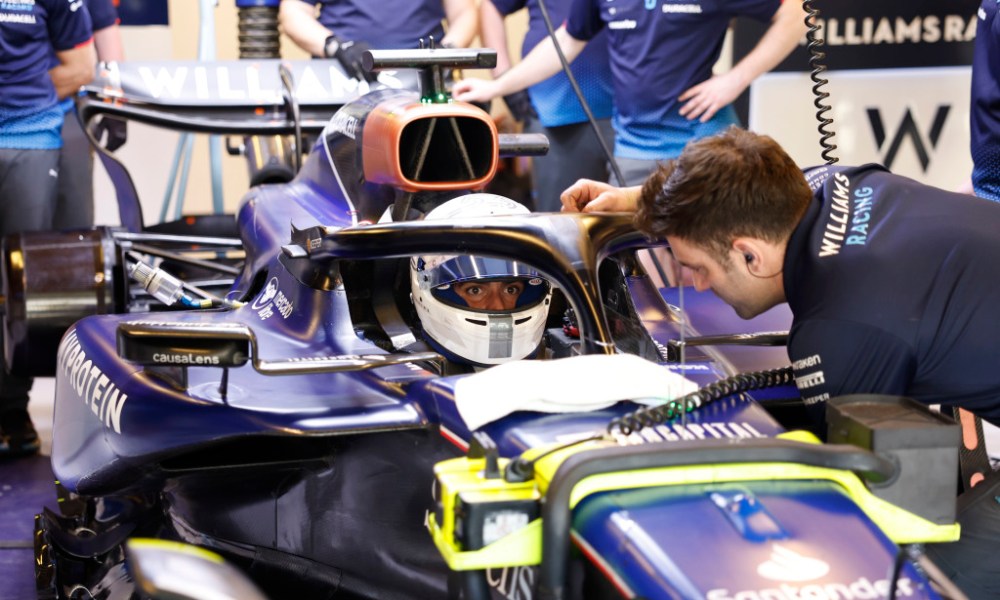 F1 pit crew servicing race car