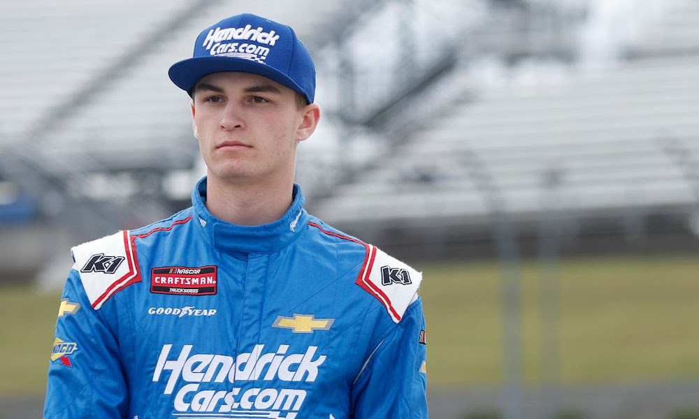 Race driver in blue uniform