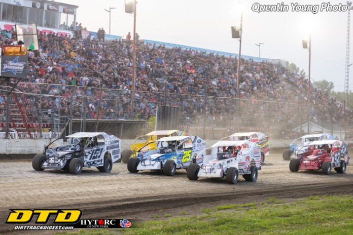 Sprint cars racing on dirt track