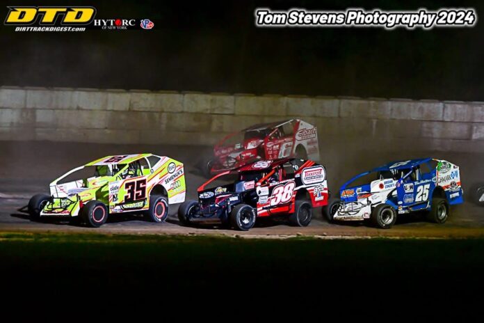 Three dirt track racers competing