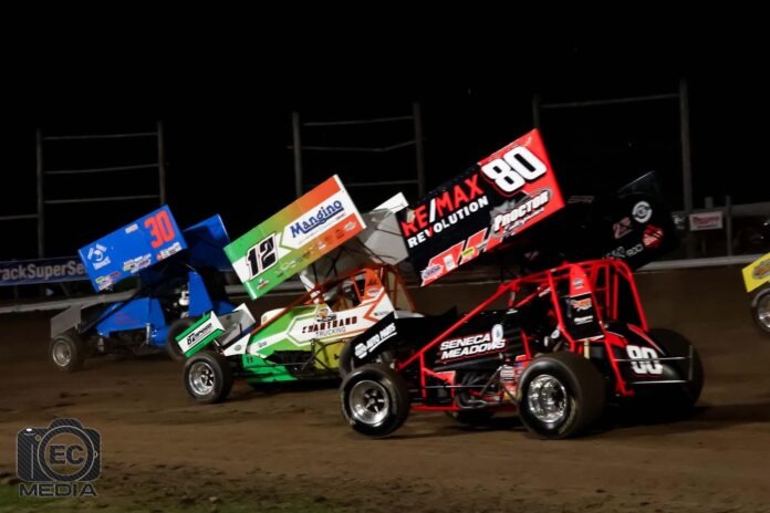 Sprint cars racing on dirt oval