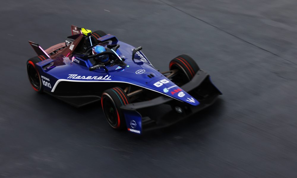 Indycar racing on blue-paved track