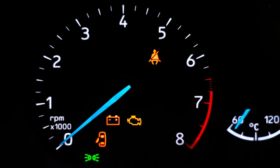 Car dashboard warning lights illuminated