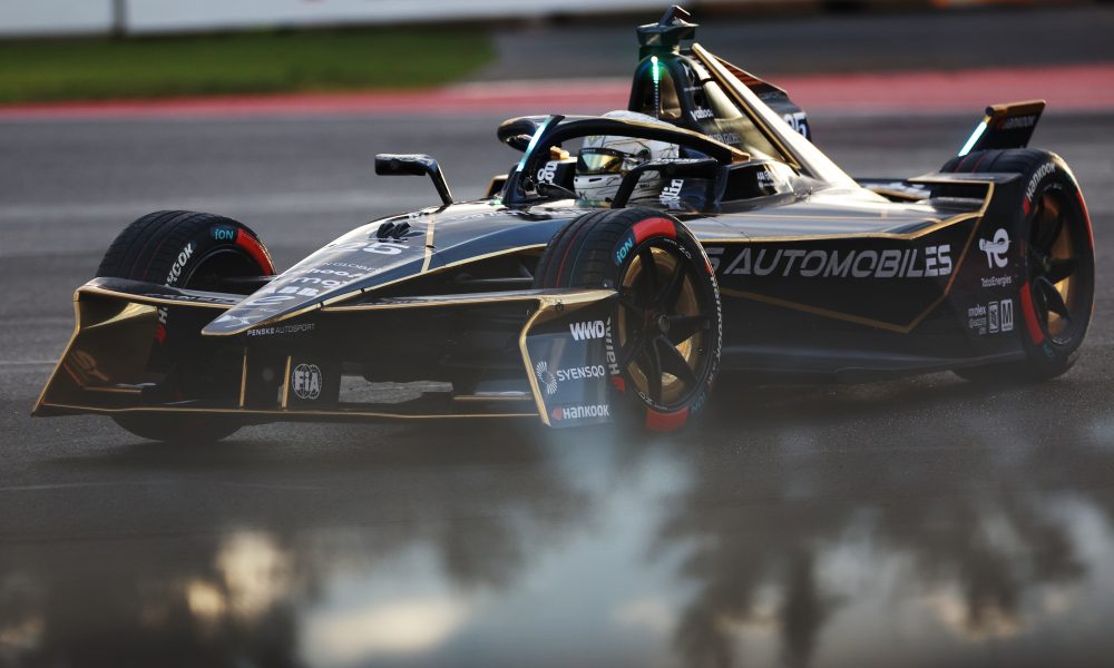 Black Indy car on racetrack