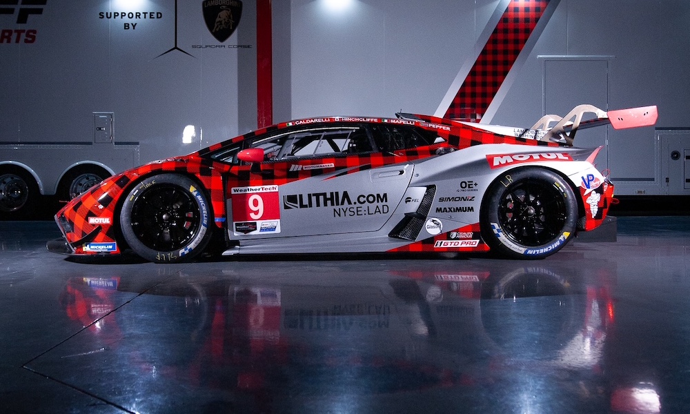 Red and white racecar outdoors