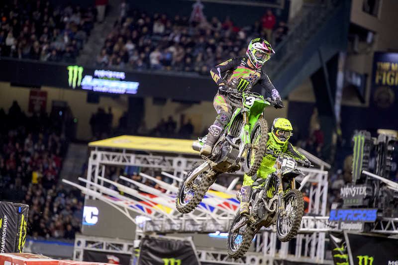 Motocross racers jumping at Anaheim Supercross