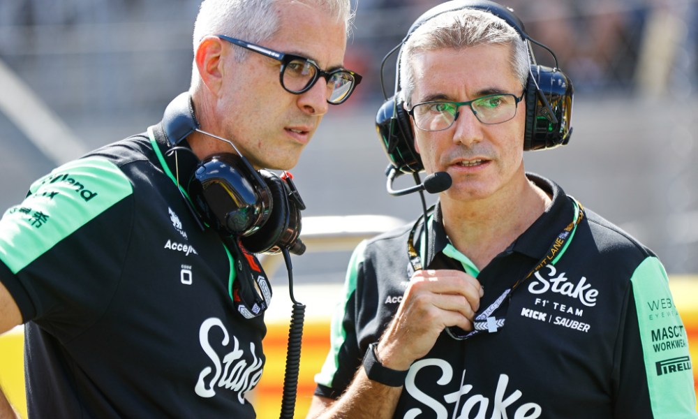 Two racing officials wearing headsets