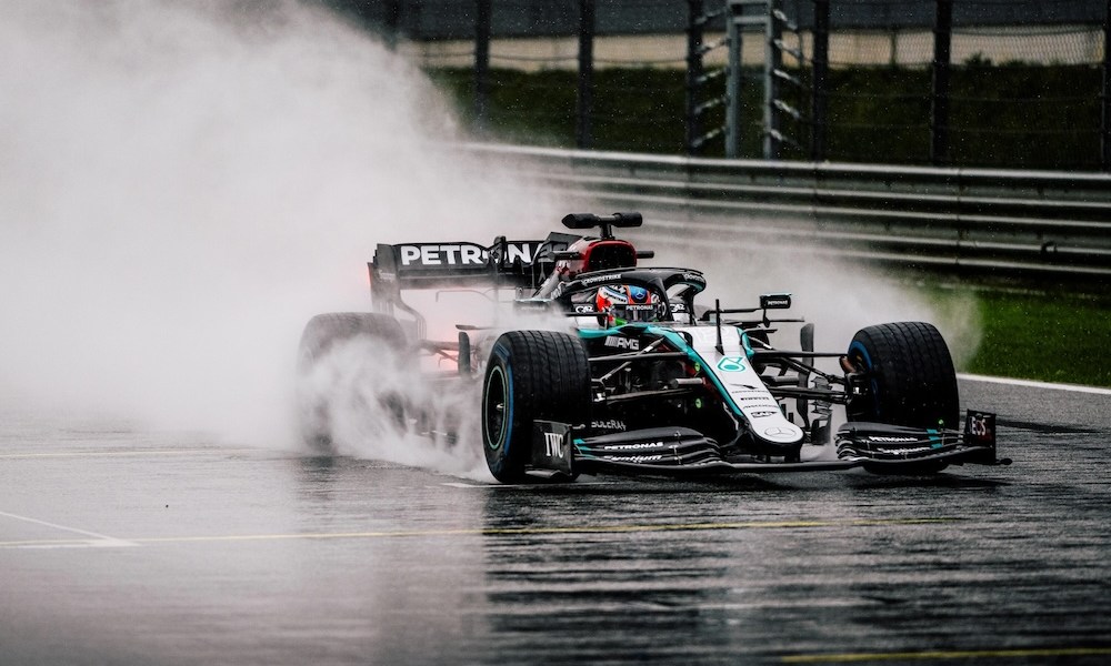 F1 car racing in rain