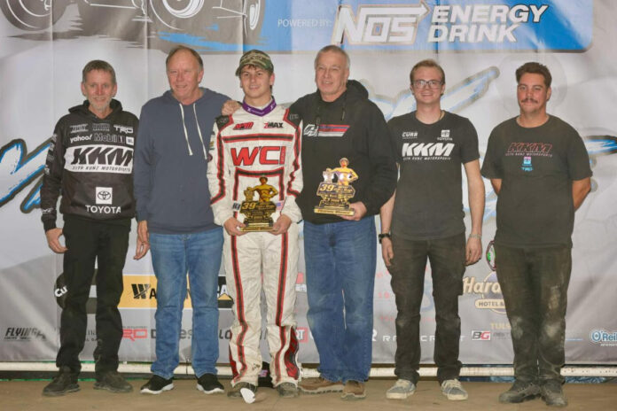 Group of men at dirt track