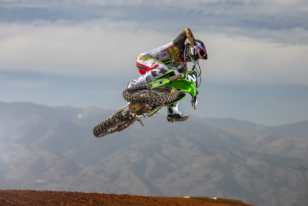 Kawasaki motocross rider jumping through air