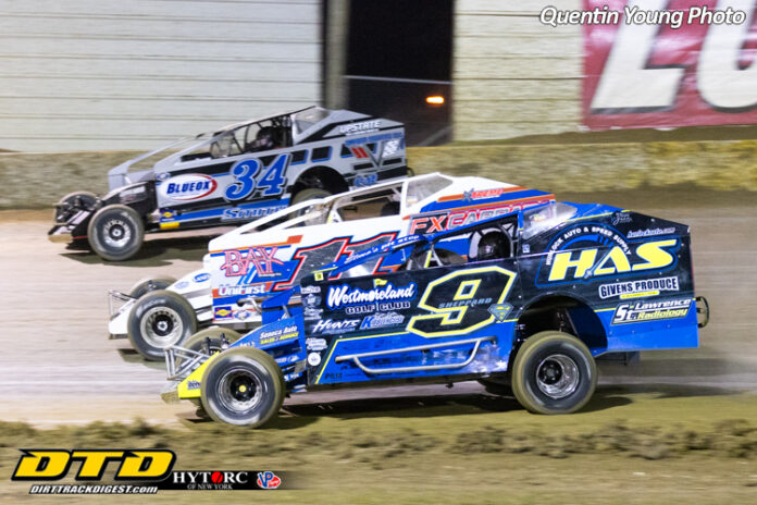 Sprint cars racing on dirt track