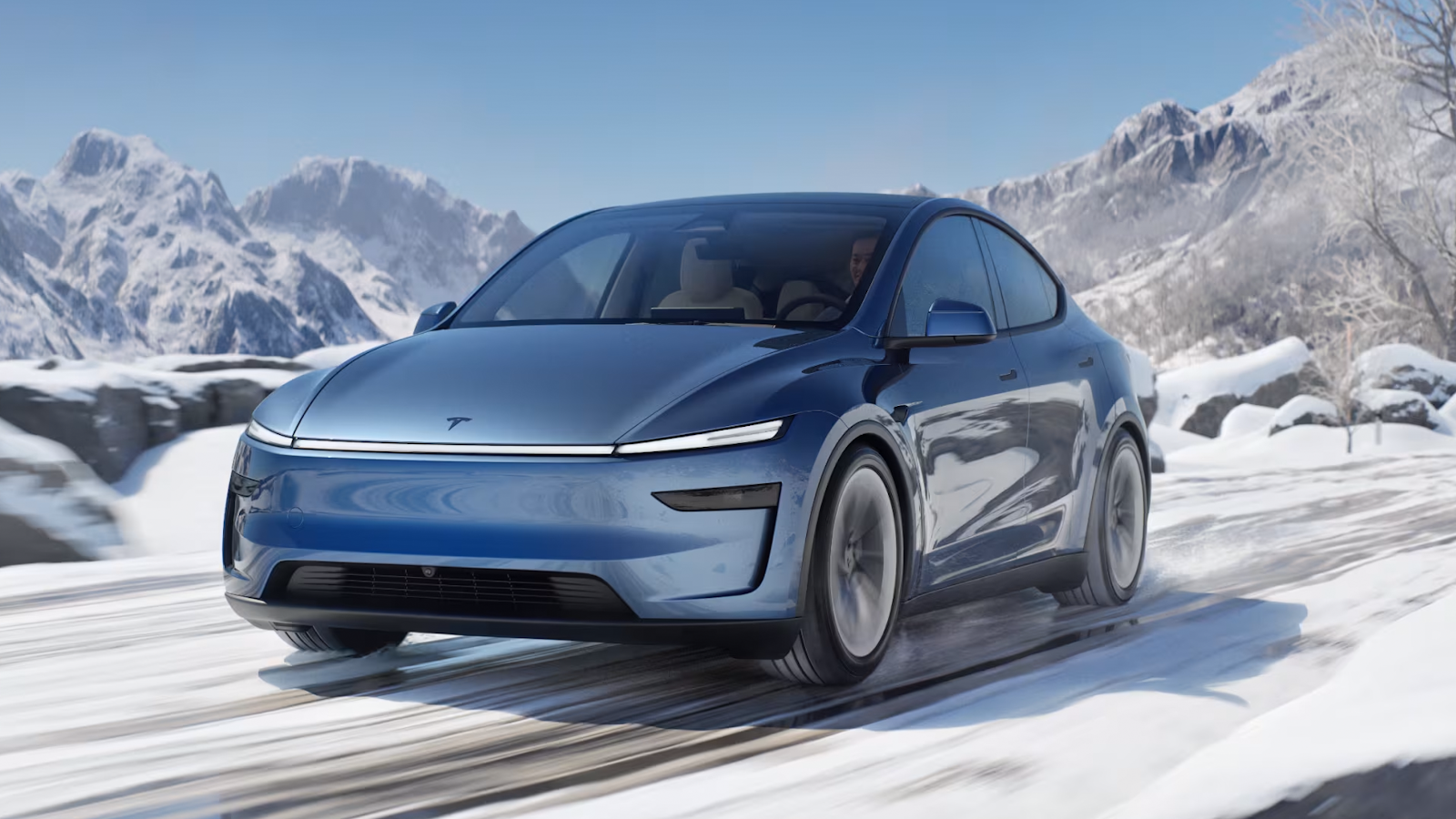 Tesla Model Y driving in snow