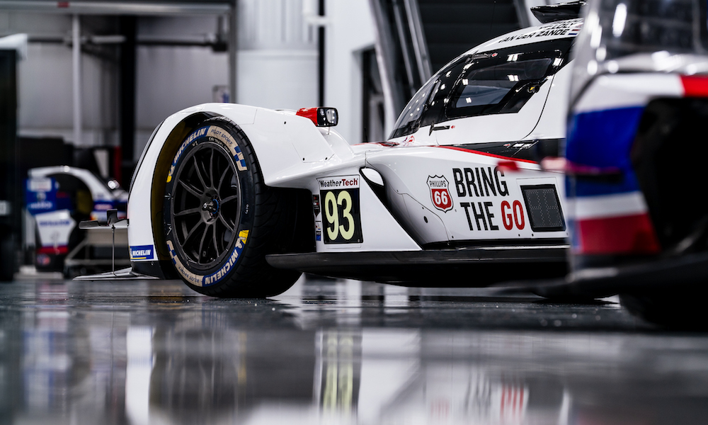 Red racing car on racetrack