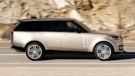 Range Rover driving on country road