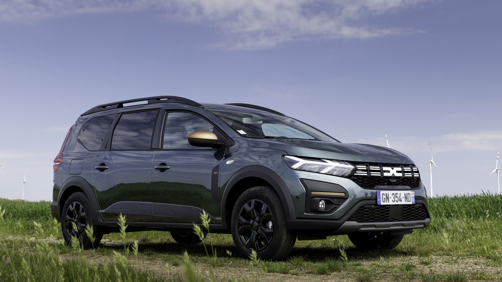 Dacia Jogger near wind turbines