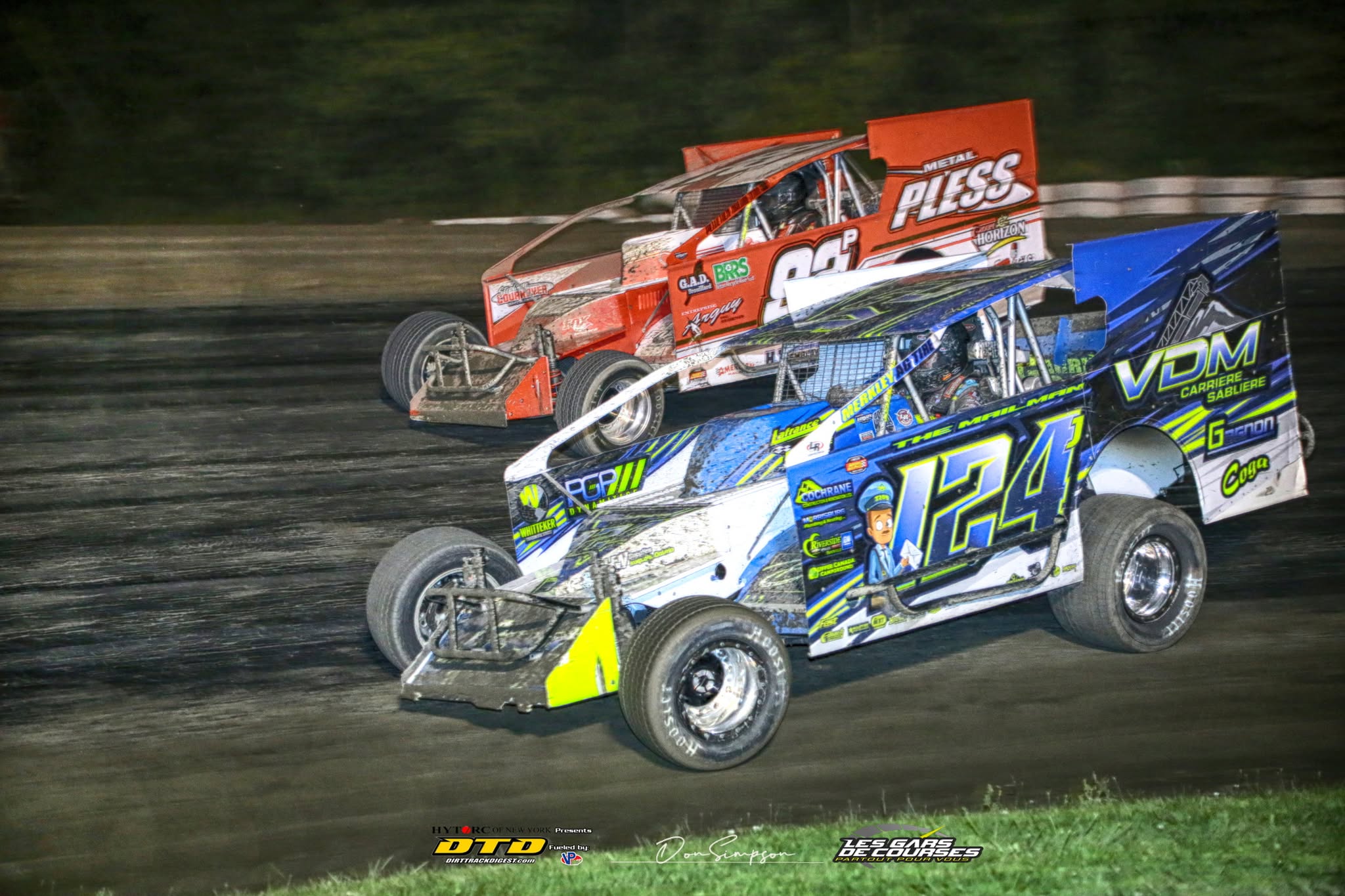 Sprint cars racing on dirt track