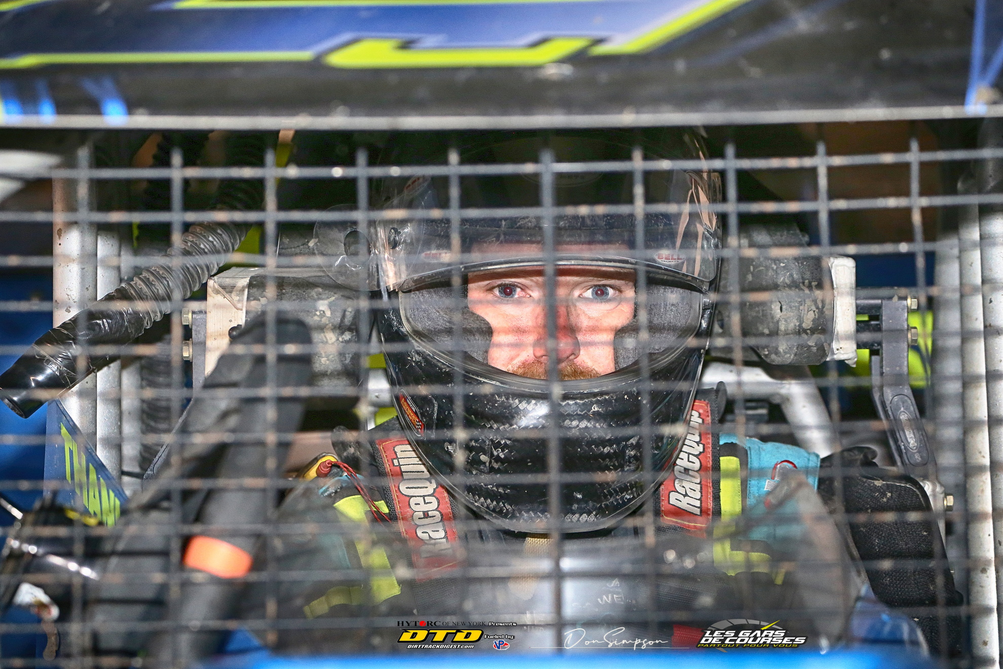 Race car driver wearing helmet